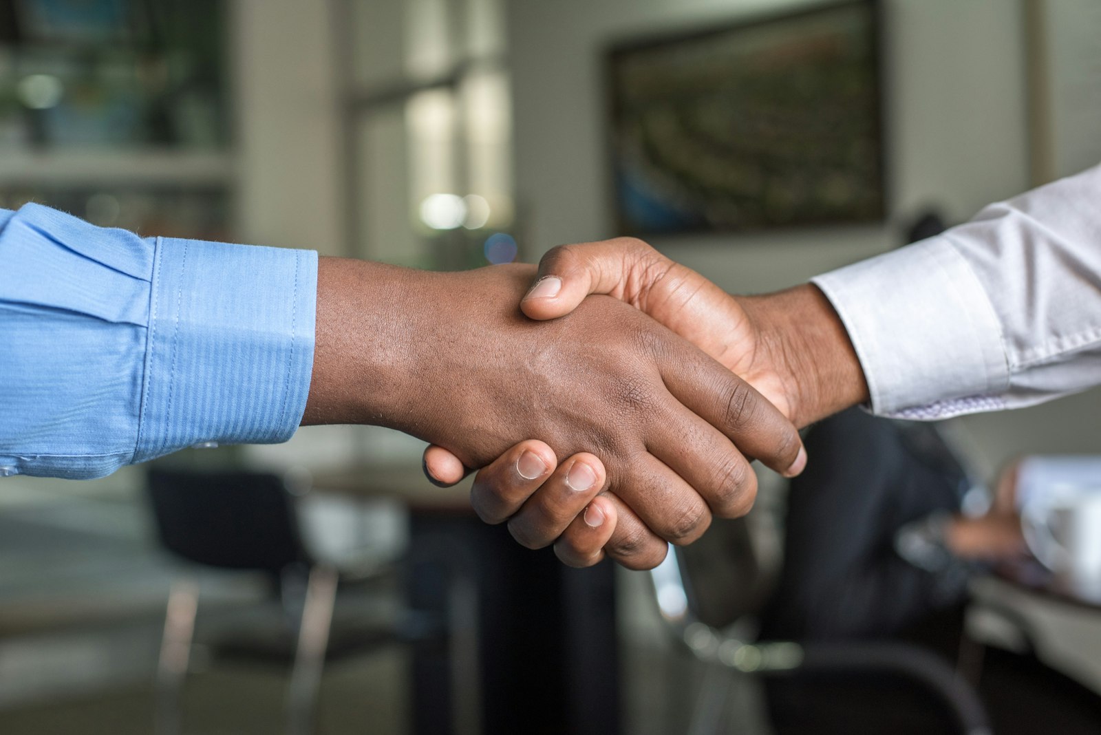 Partnership handshake between two business people