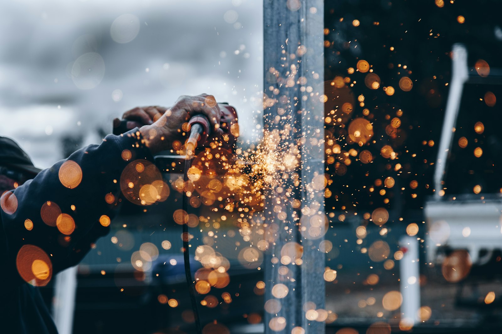 Fabrication work with grinding sparks in a workshop